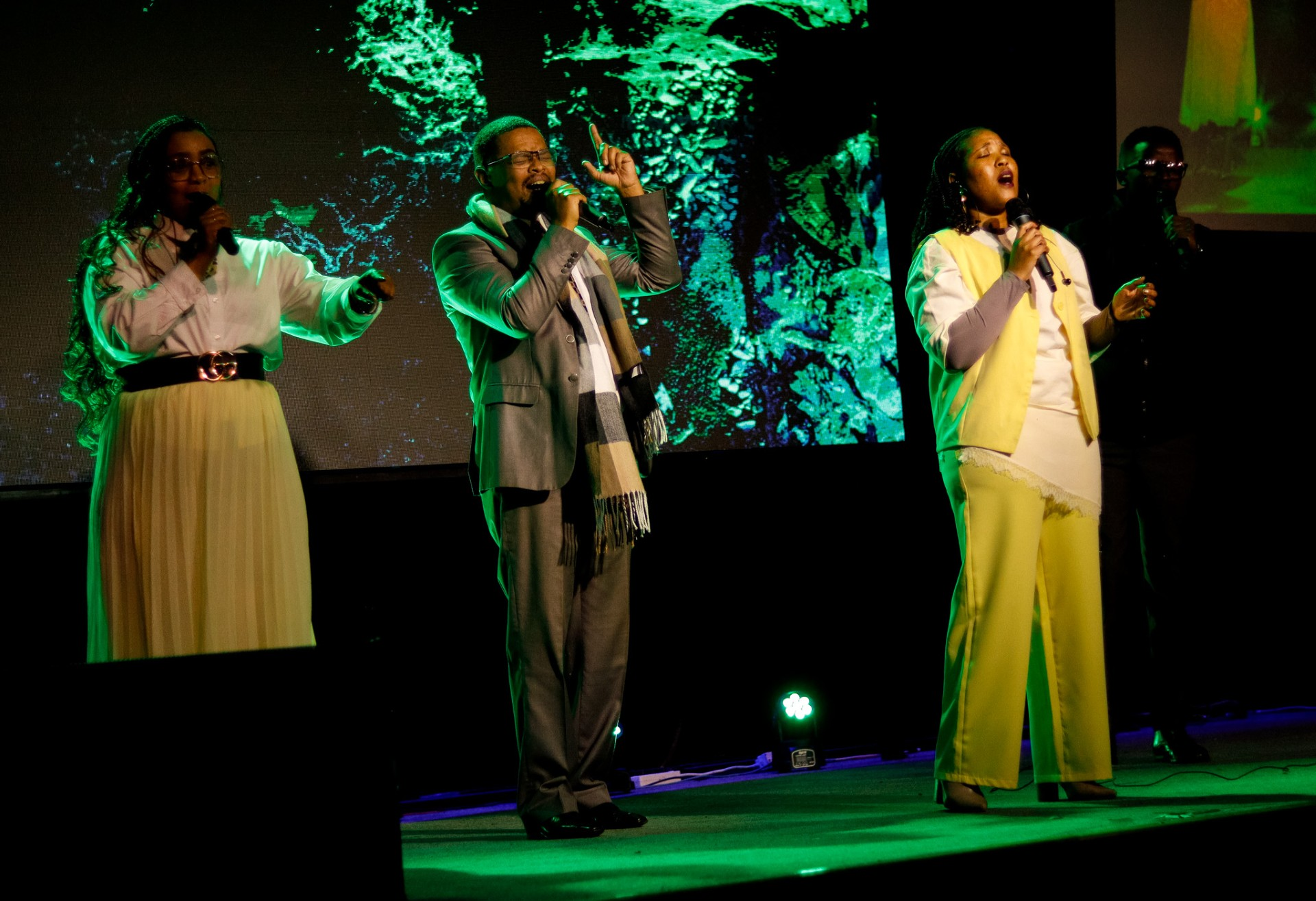 Worship team singing on stage